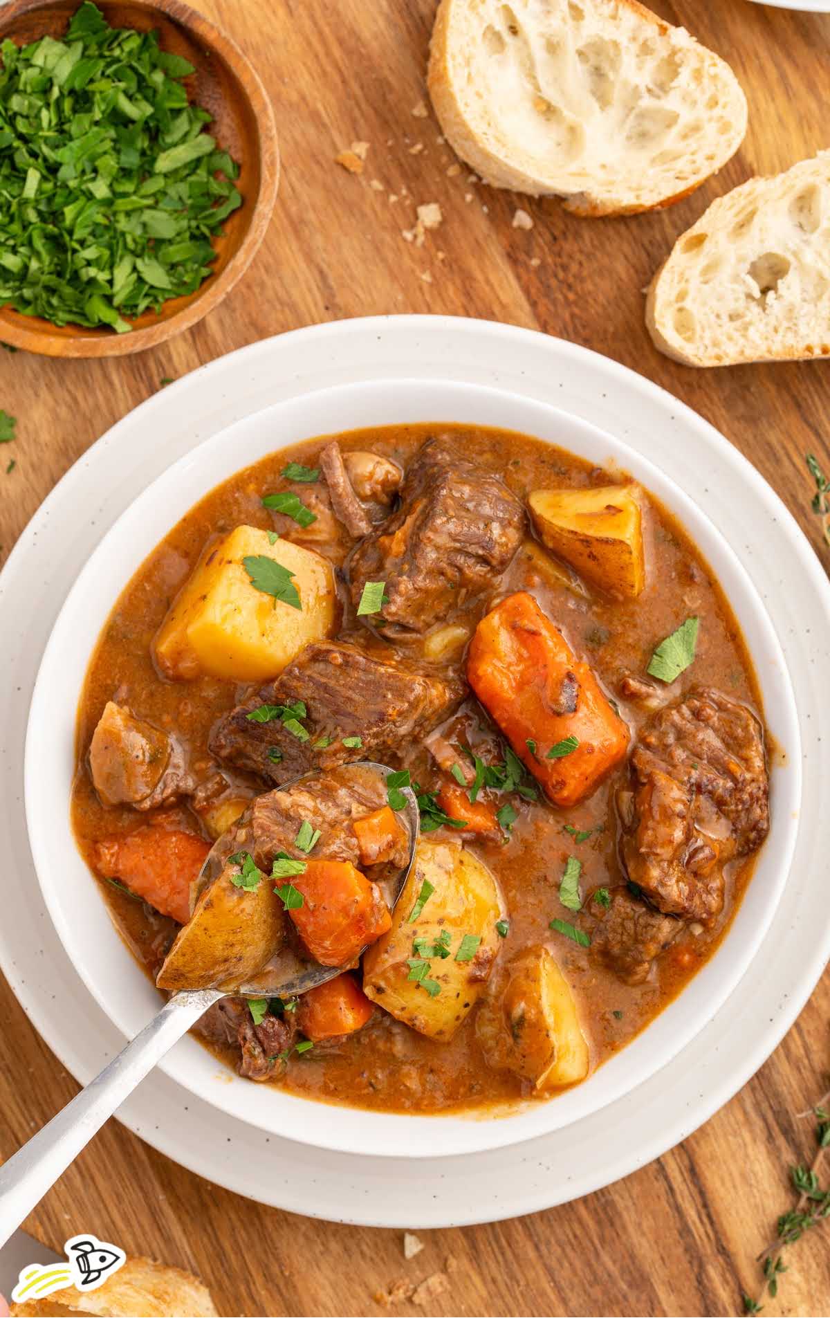 a bowl of Beef Brisket Stew topped with parsley