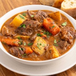 a bowl of Beef Brisket Stew topped with parsley