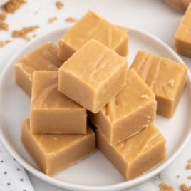 Brown Sugar Fudge stacked on top of each other on a plate