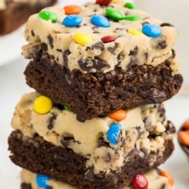 slices of Cookie Dough Brownies stacked on top of each other