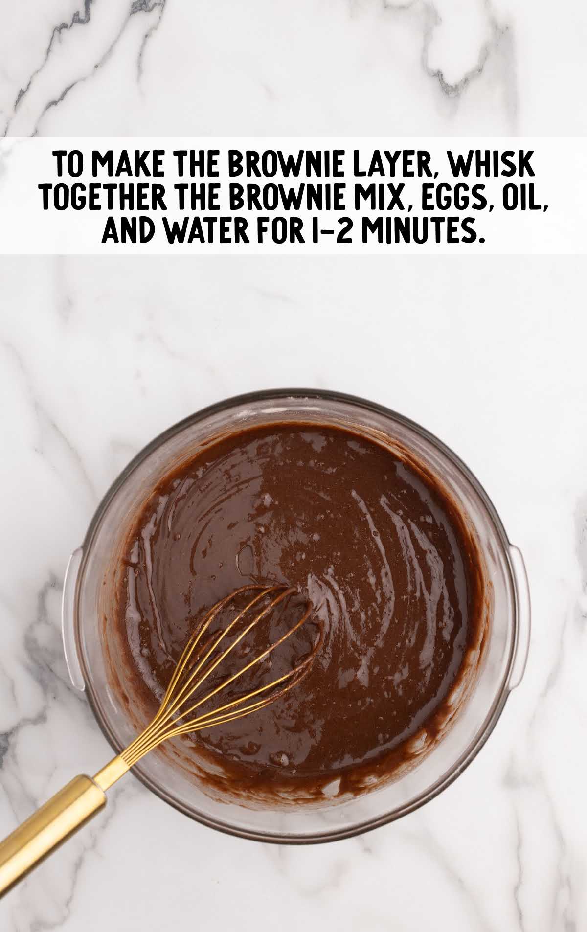 fudge brownie mix, eggs, vegetable oil, and water whisked together in a bowl