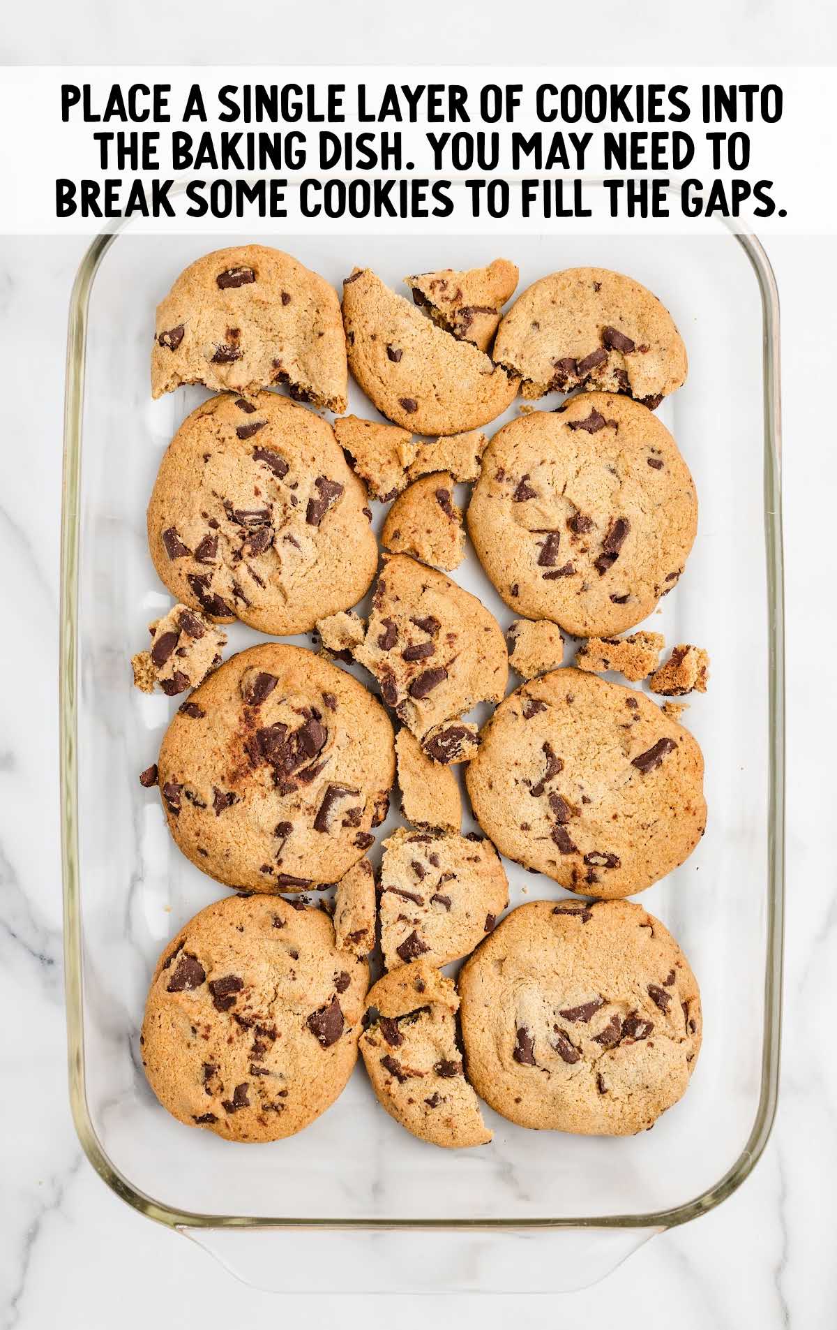 single layer of the soft-batch chocolate chip cookies added into the bottom of a baking dish