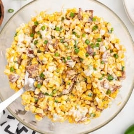 a bowl of Cracked Corn Salad with a spoon