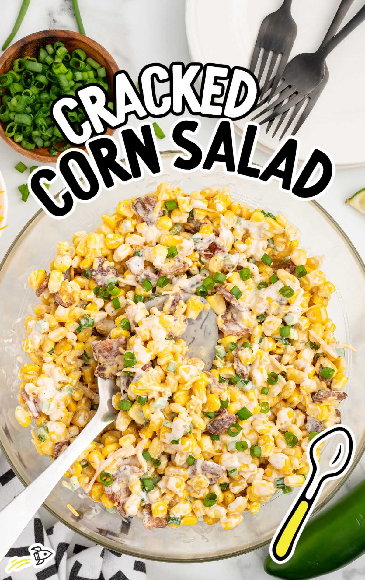 a bowl of Cracked Corn Salad with a spoon