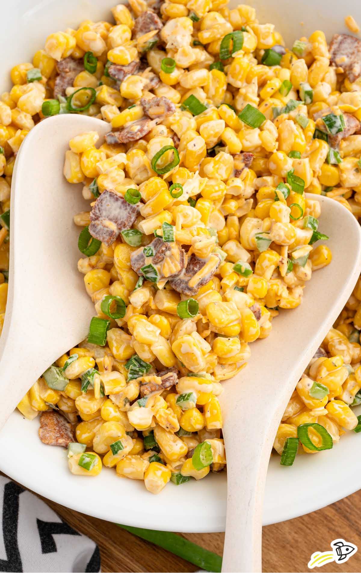 a bowl of Cracked Corn Salad with a spoon