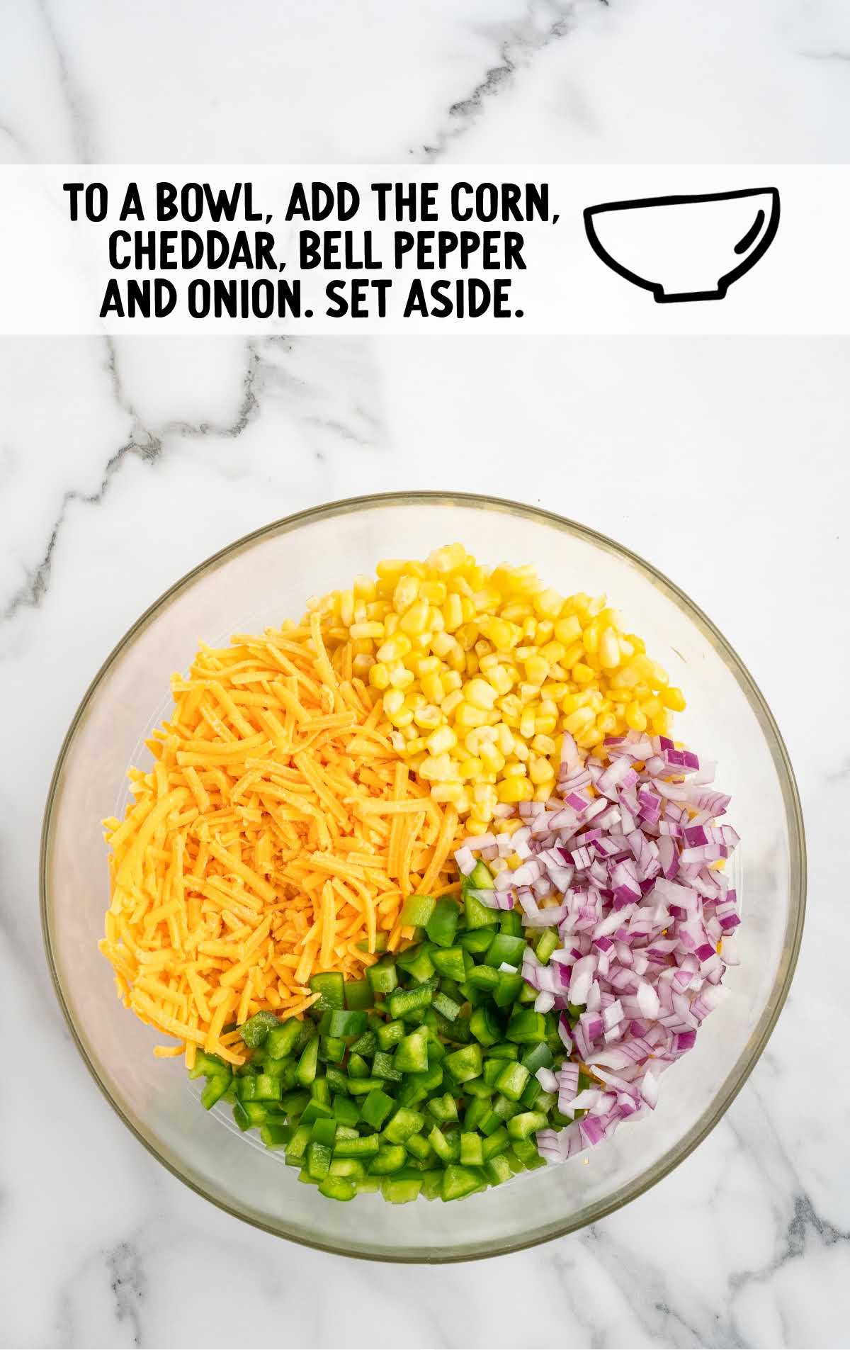 thawed and drained yellow corn kernels, shredded sharp cheddar cheese, diced green bell pepper, and diced red onion combined in a bowl