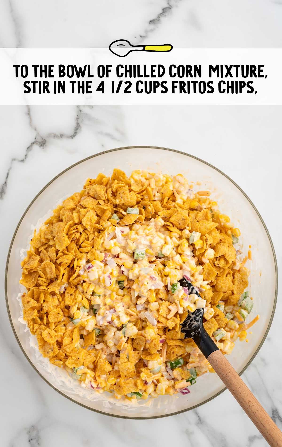 roughly crushed Fritos corn chips stirred into the bowl of corn mixture