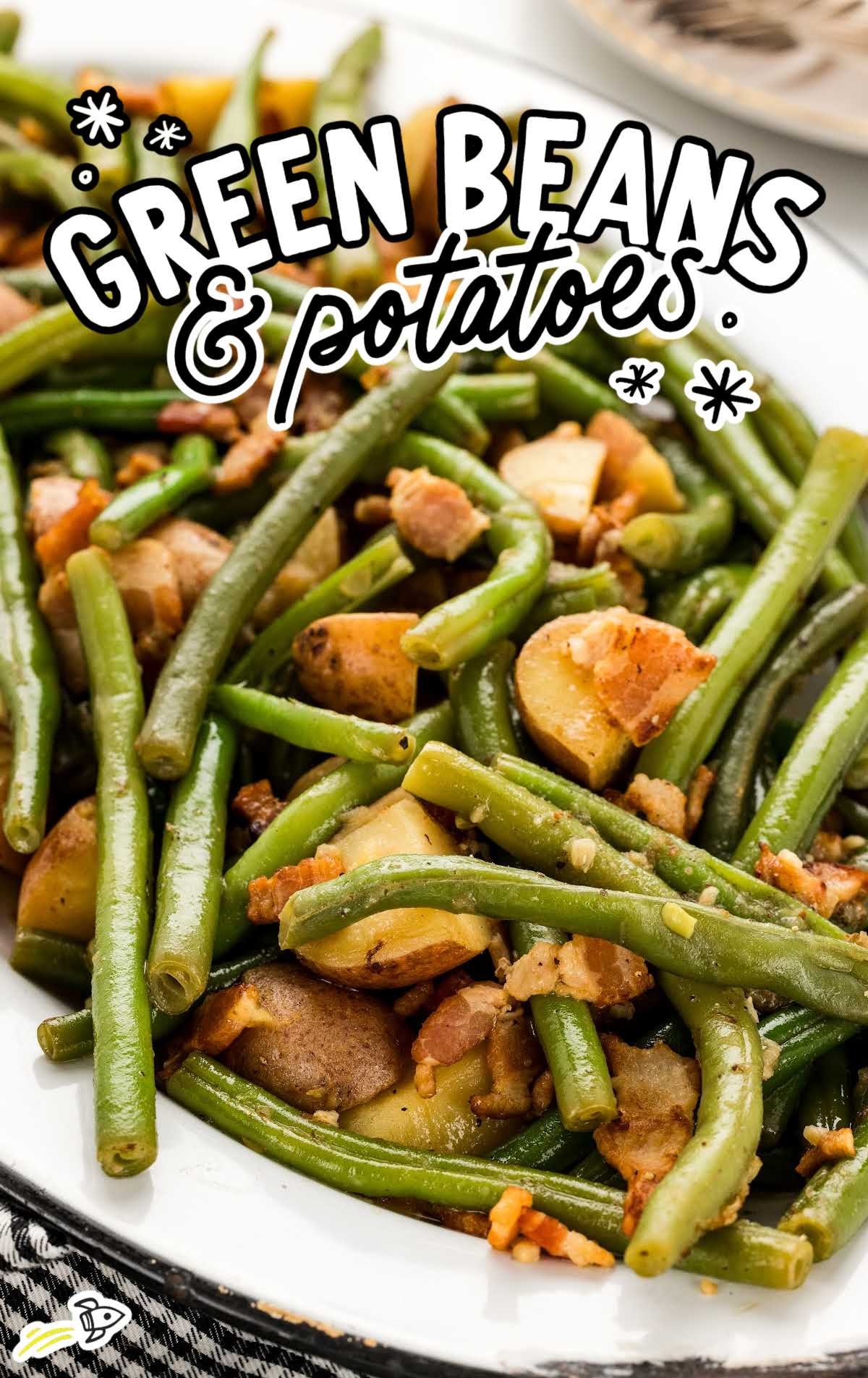 a plate of green beans and potatoes