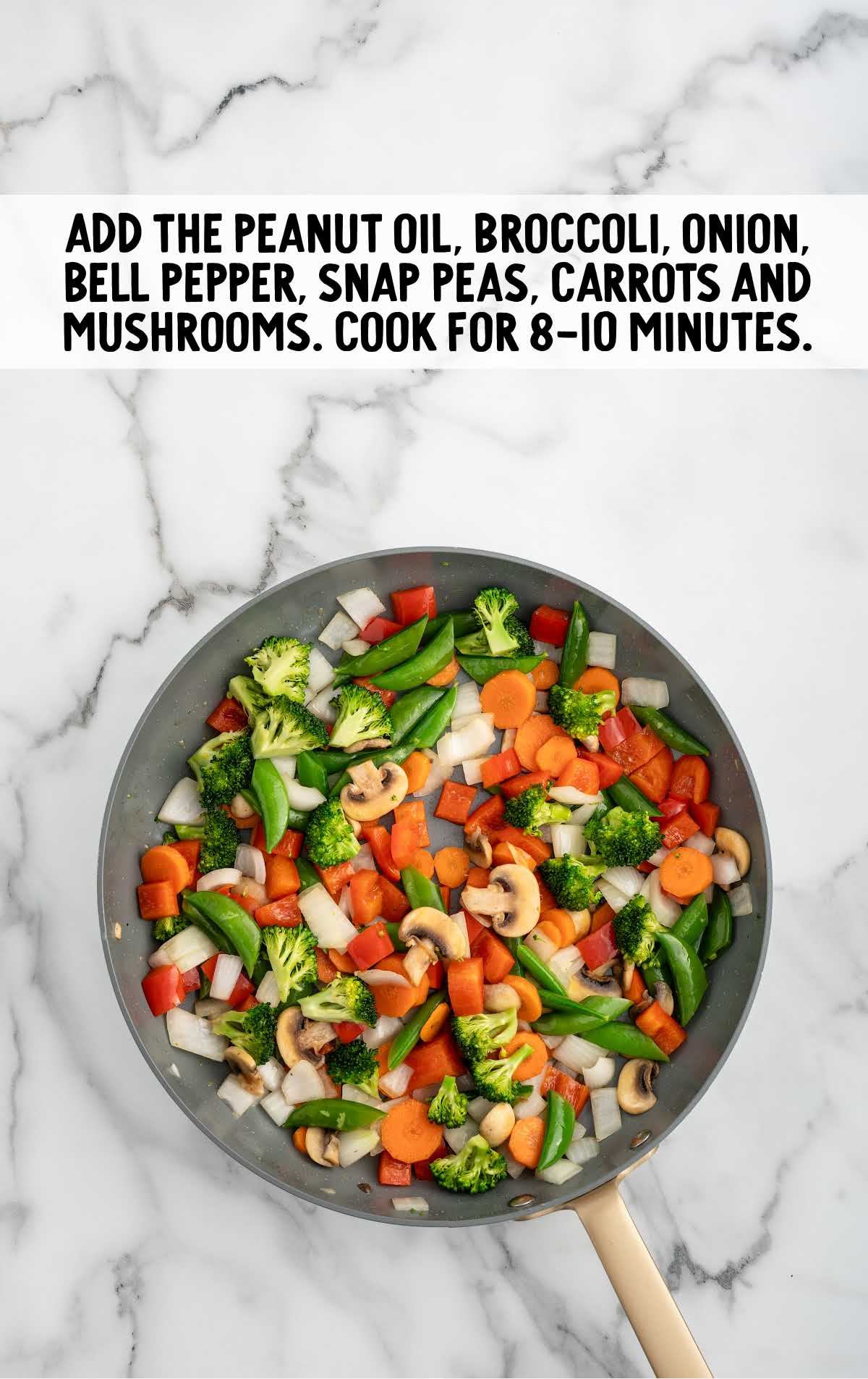 peanut oil, followed by the broccoli florets, diced sweet yellow onion, red bell pepper, sugar snap peas, carrots, and sliced mushrooms added to the skillet