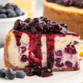 a slice of Lemon Blueberry Cheesecake on a plate