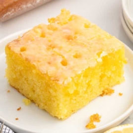 a slice of Lemon Jello Cake on a plate