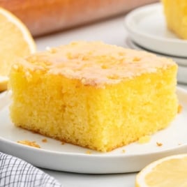 a slice of Lemon Jello Cake on a plate