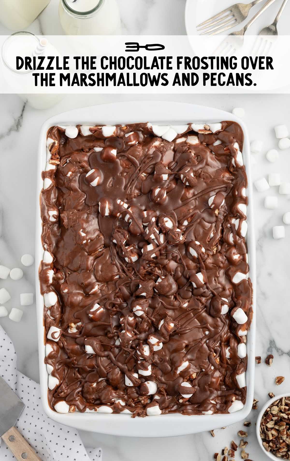 chocolate frosting drizzled over the marshmallows and pecans