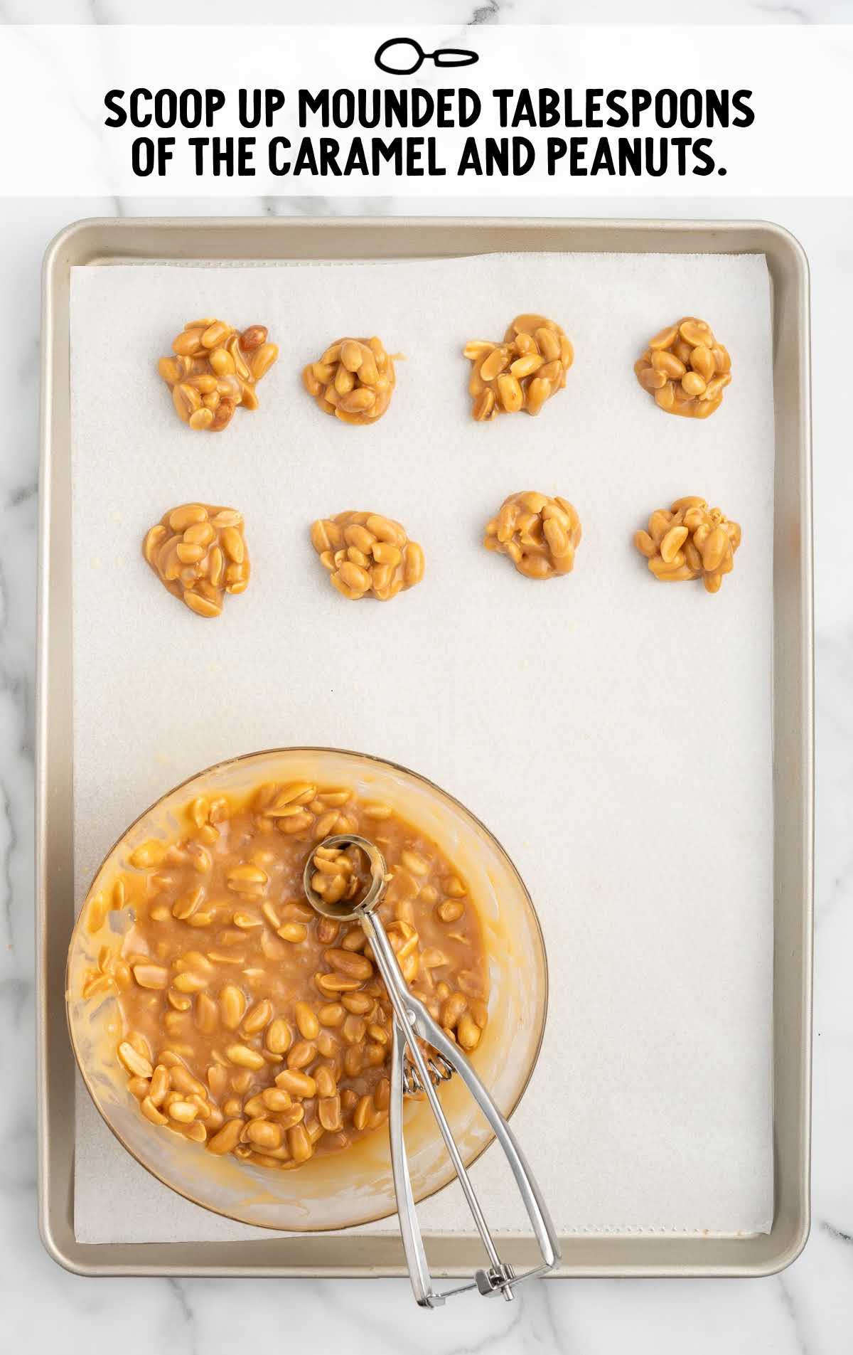 mounded heaps of the caramel and peanut mixture scooped onto the baking sheet