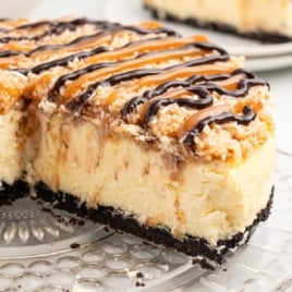 Samoa Cheesecake topped with caramel and chocolate sauce