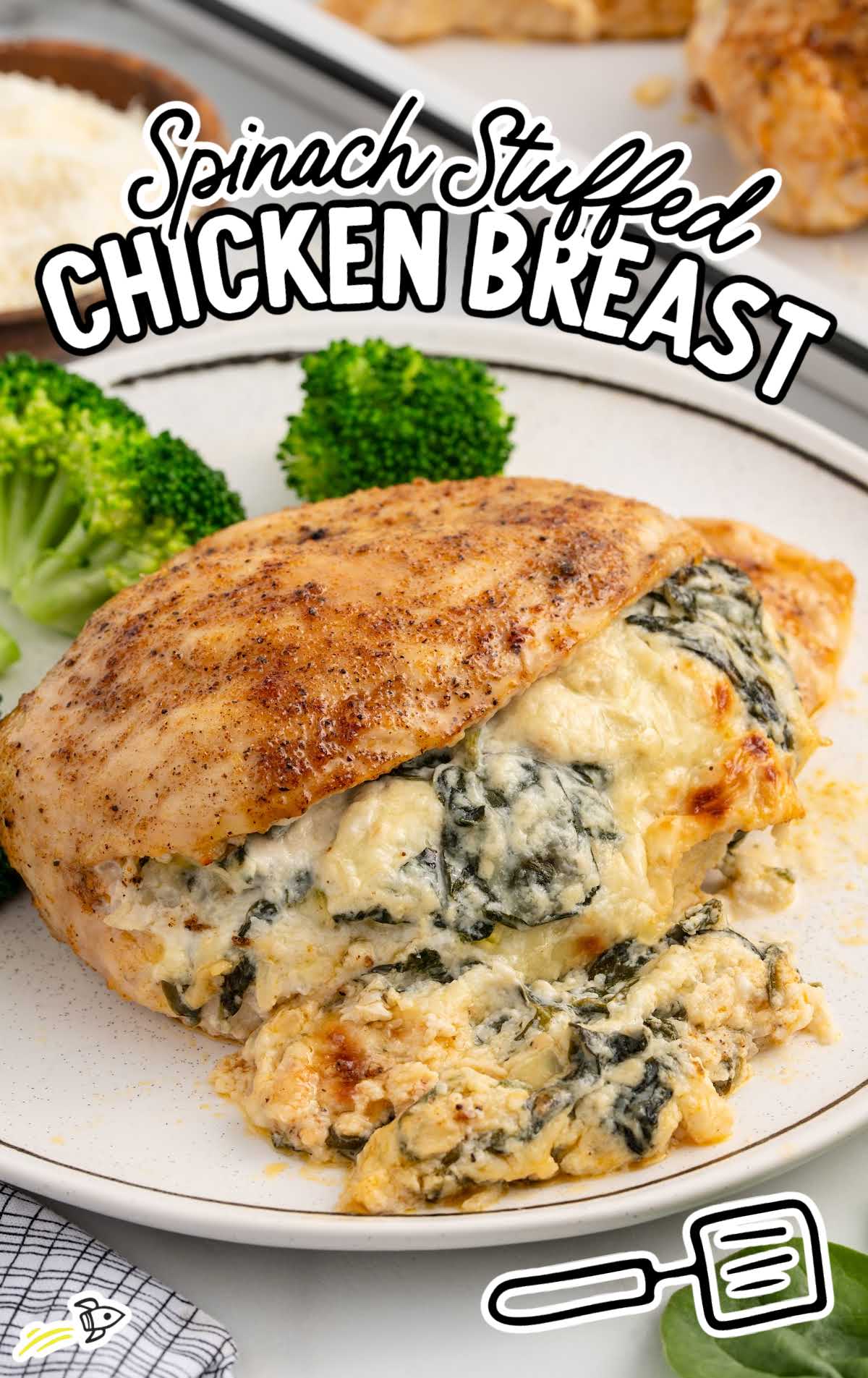 a plate of Spinach Stuffed Chicken Breast with broccoli