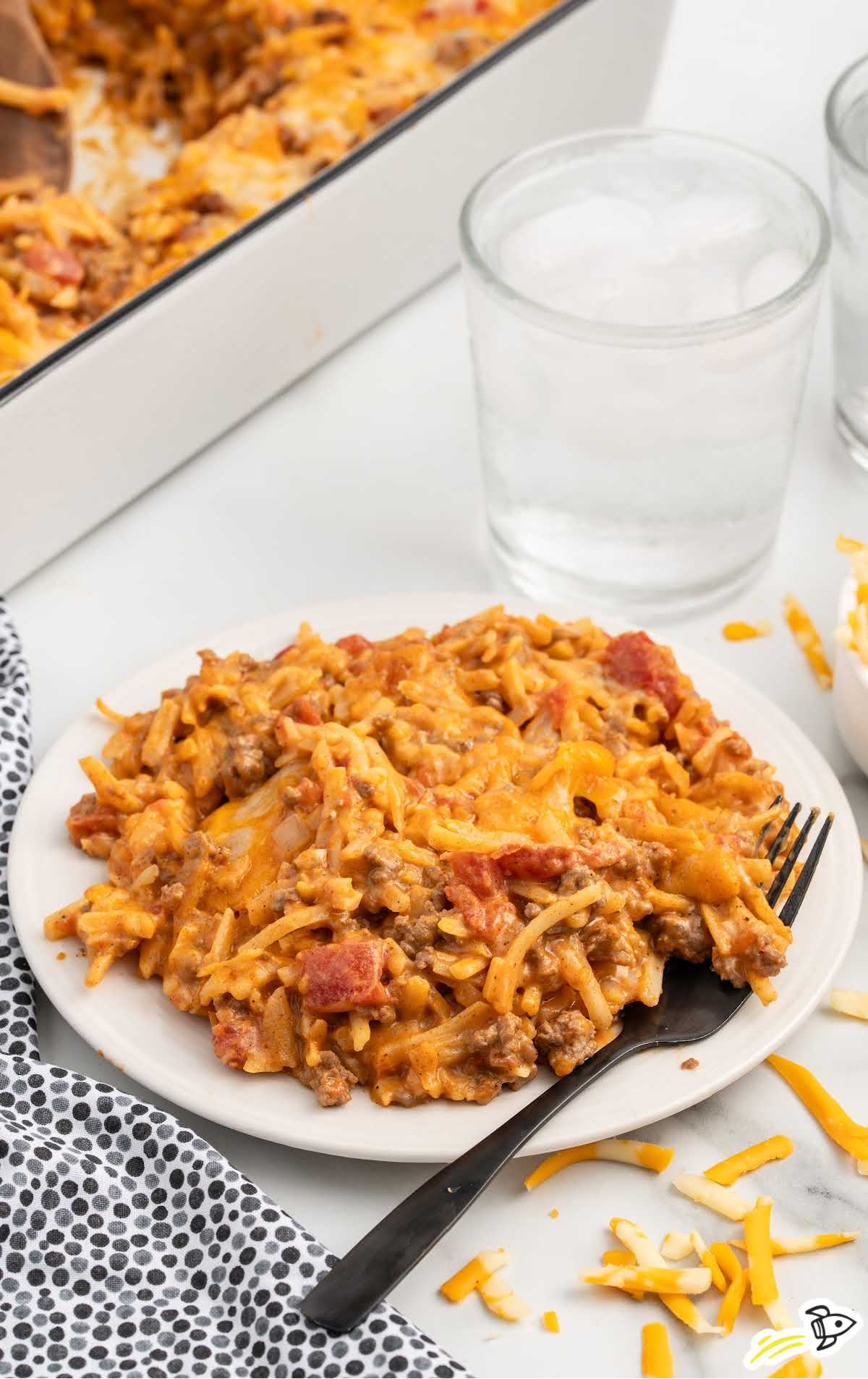 a plate of Taco Potato Casserole with a fork