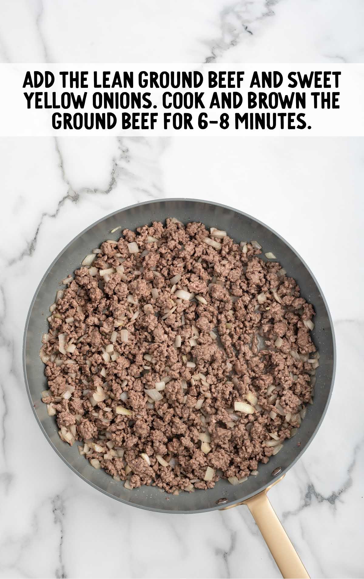 lean ground beef and diced onions cooked in a skillet