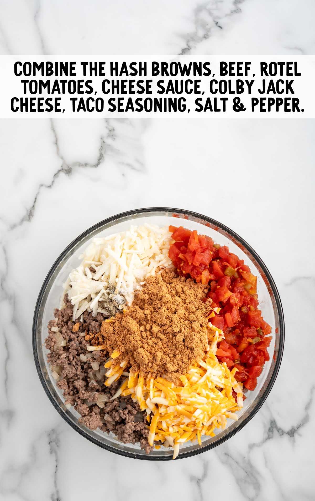 frozen shredded hash browns, cooked ground beef, Rotel diced tomatoes & green chilies, mild cheddar cheese sauce, shredded colby jack cheese, taco seasoning, salt, and black pepper combined in a bowl