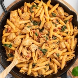 a skillet of Tuscan Chicken Pasta