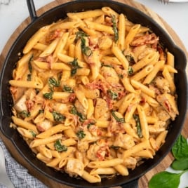 a skillet of Tuscan Chicken Pasta