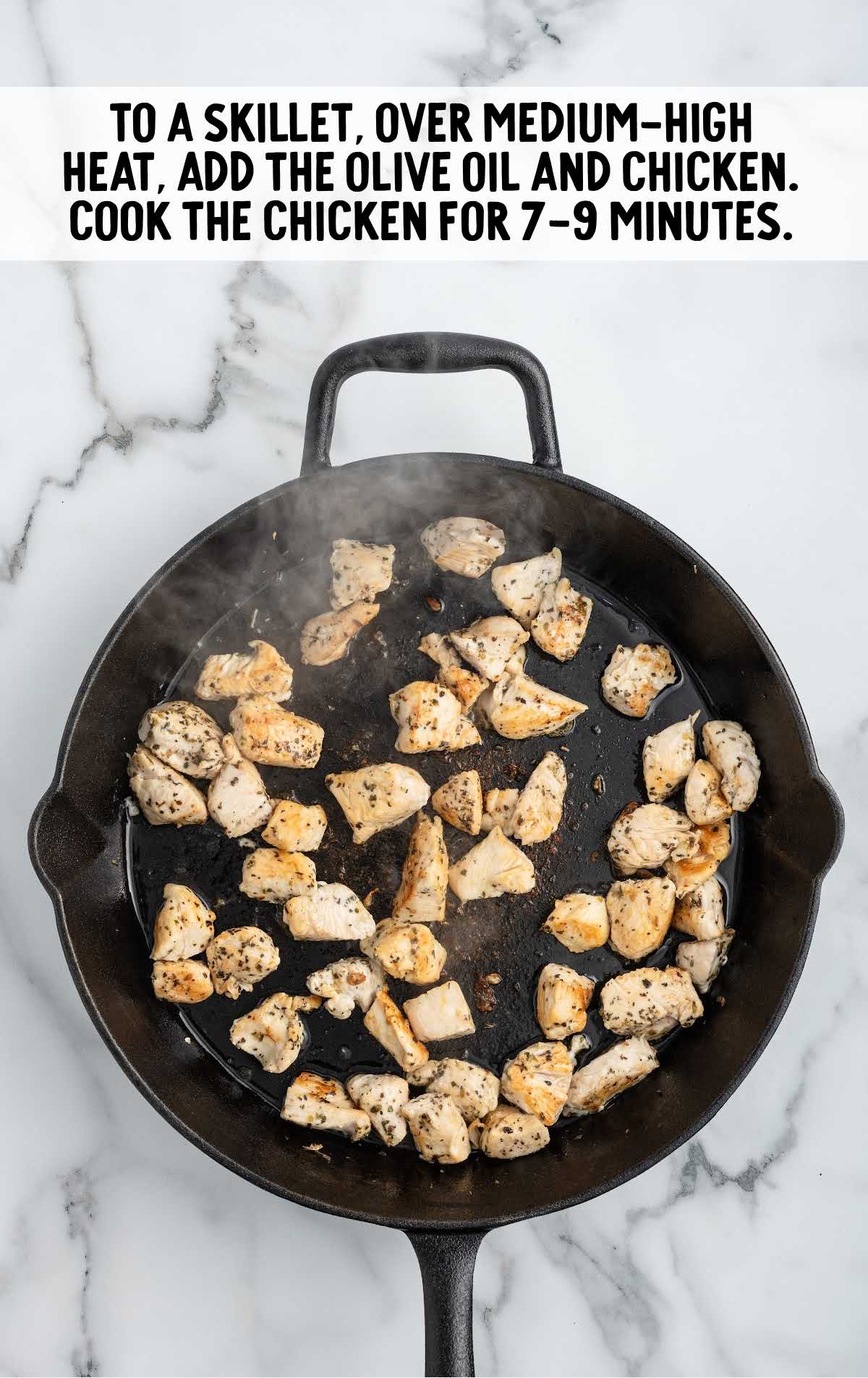 pieces of seasoned chicken breast cooked in a skillet