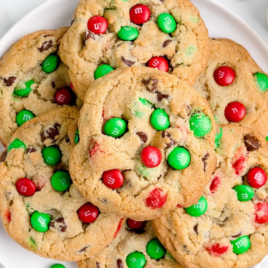 A plate of M&M christmas cookies covered in red and green M&Ms.