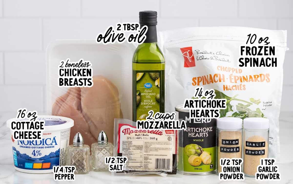 Ingredients for spinach and artichoke chicken casserole including chicken breasts, frozen spinach, artichoke hearts, cottage cheese, mozzarella, olive oil, and seasonings.