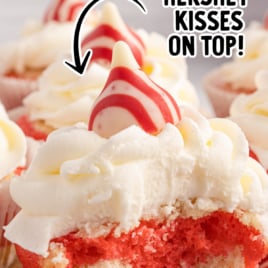 A candy cane cupcake split open to show the red and white layers.