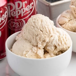 Bowl of Dr Pepper ice cream in front of soda cans with bold title text “Dr. Pepper Ice Cream”