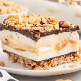a slice of Drumstick Ice Cream Cake on a plate with a fork