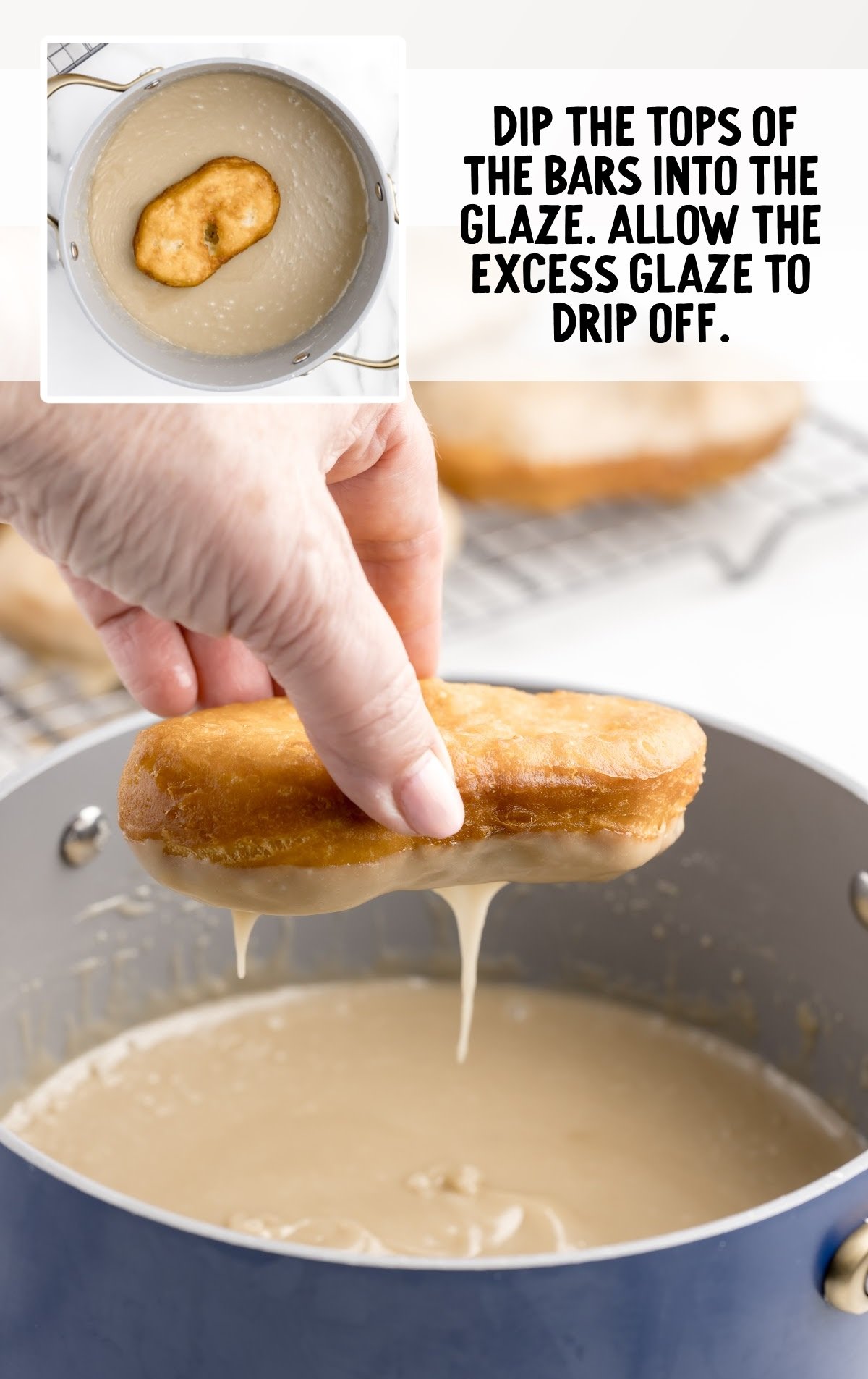 a maple bar being dipped into the glaze.