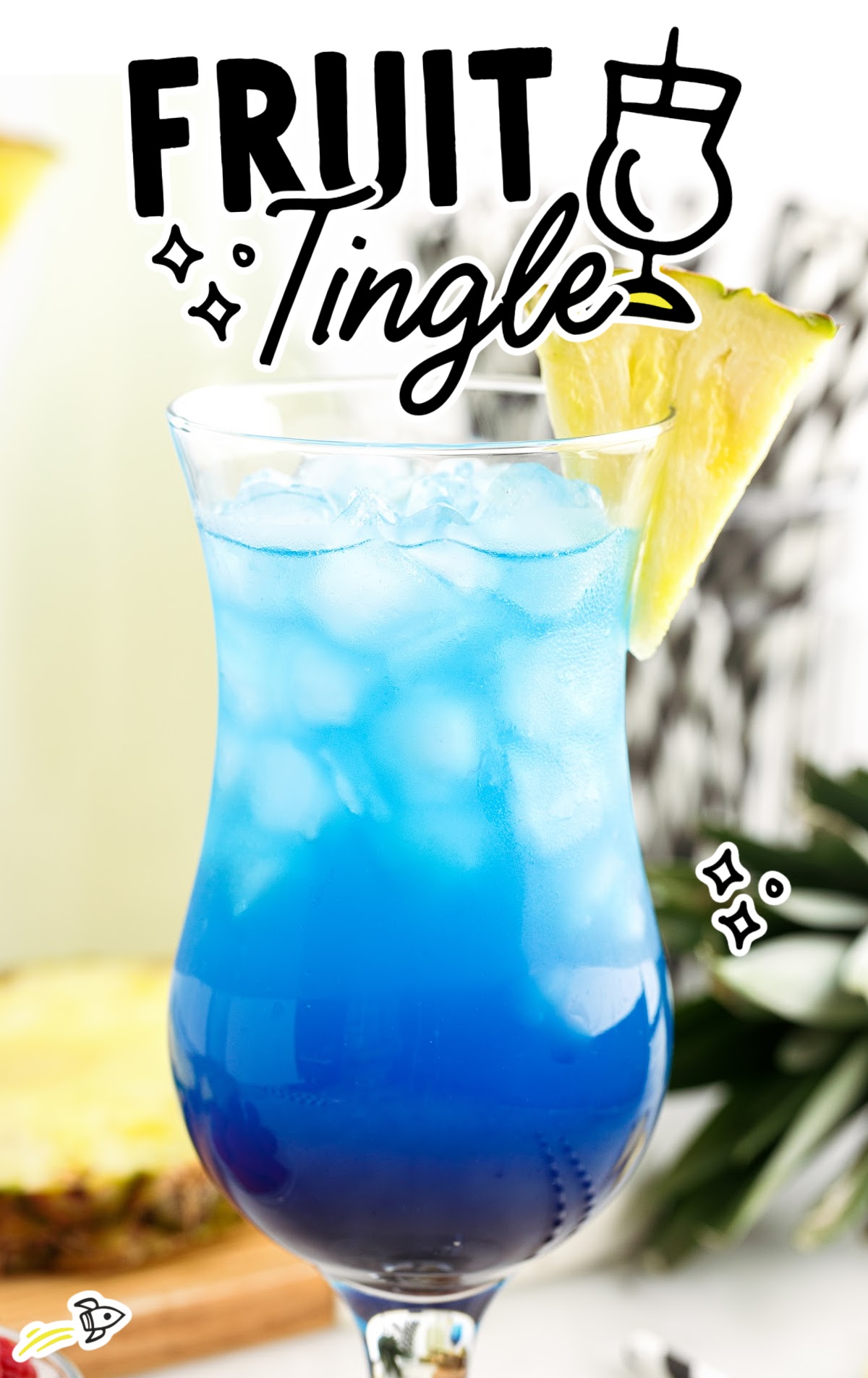 A class of Fruit Tingle cocktail garnished with pineapple. 