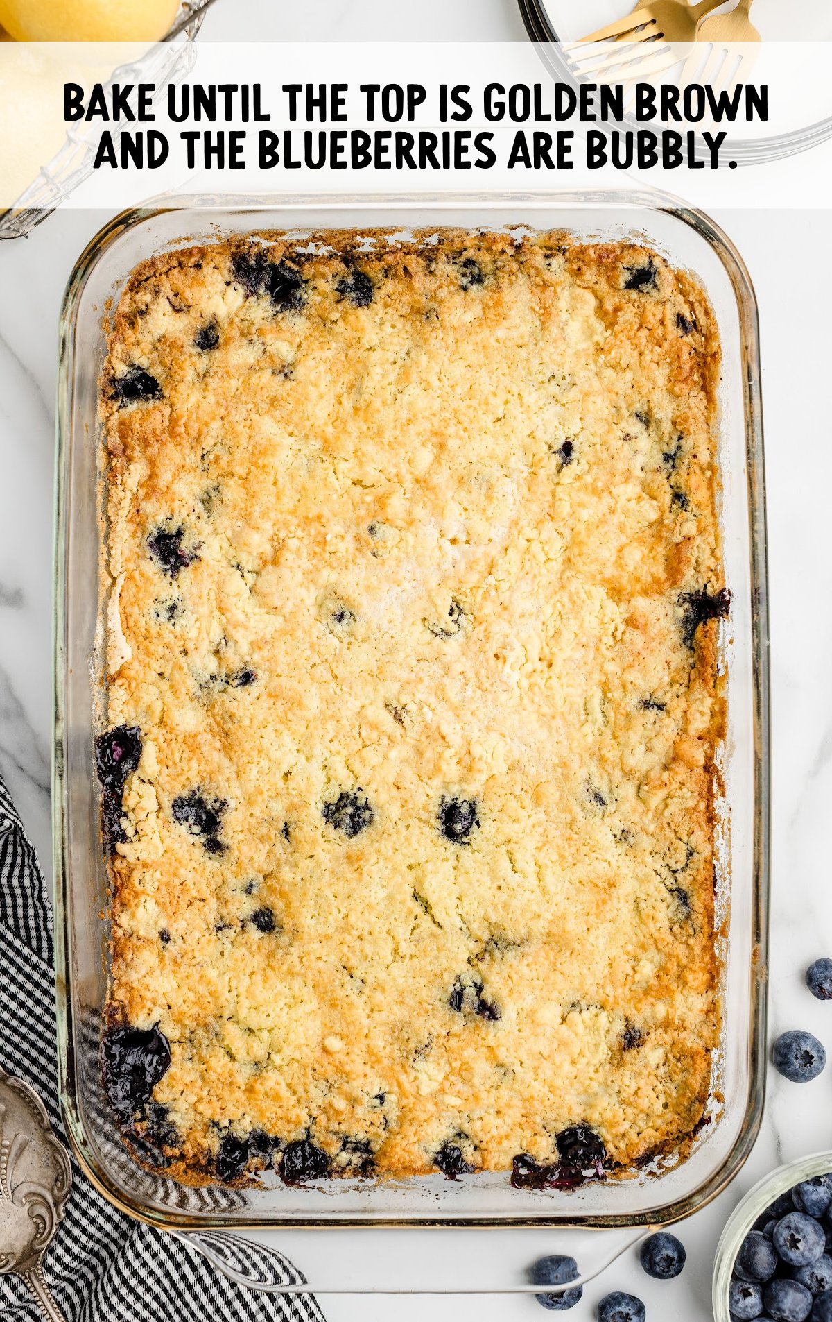 Lemon Blueberry Cobbler baked in a glass baking dish.