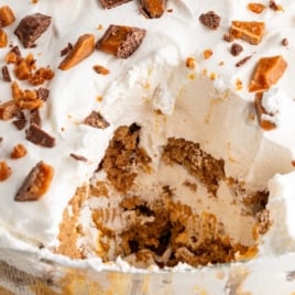 Pumpkin cheesecake trifle with a scoop removed and text overlay that says "Easy trifle anyone can make!"
