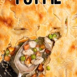 A pan of Skillet Chicken Pot Pie with a serving scooped out of it.