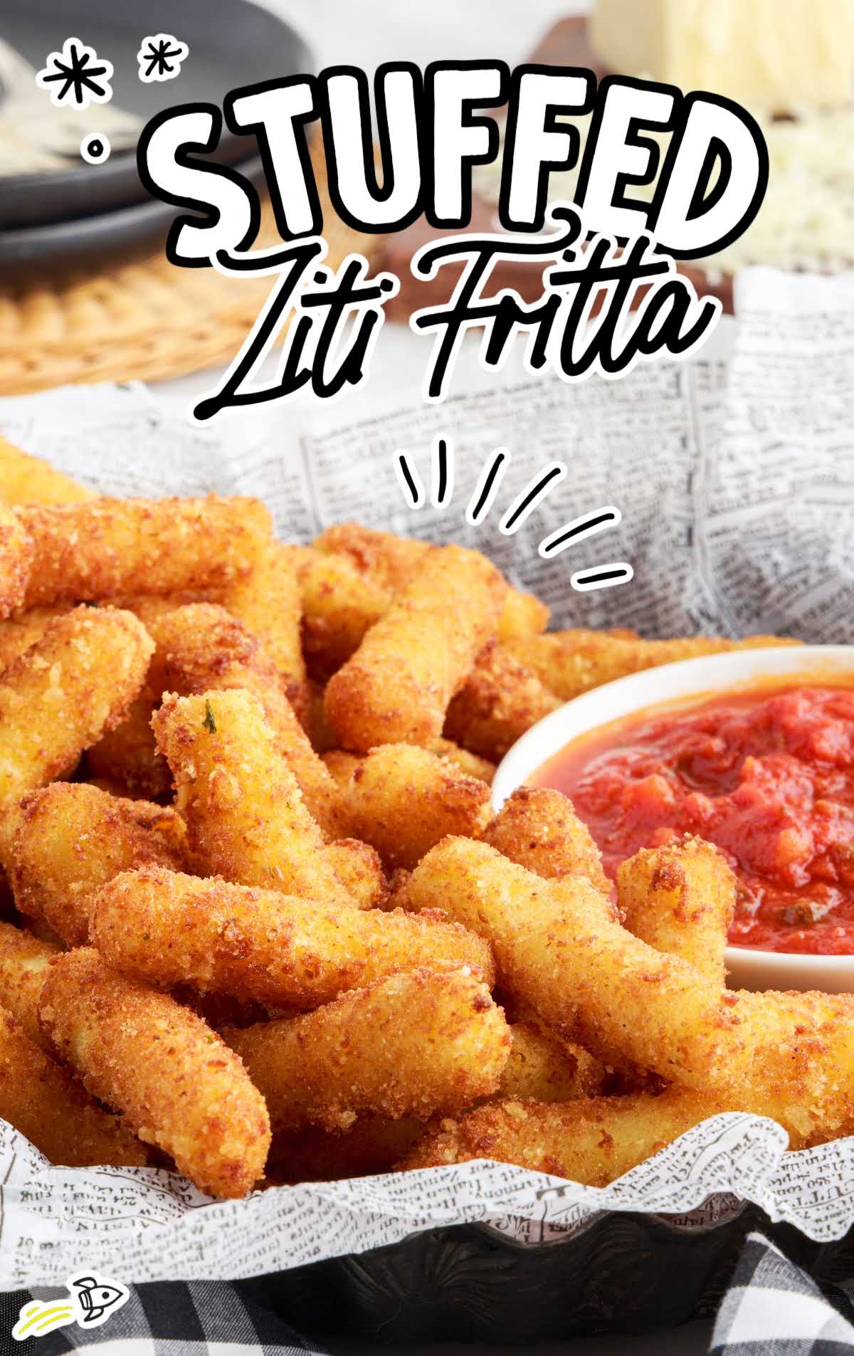 A basket of Stuffed Ziti Fritta a with a bowl of marinara sauce