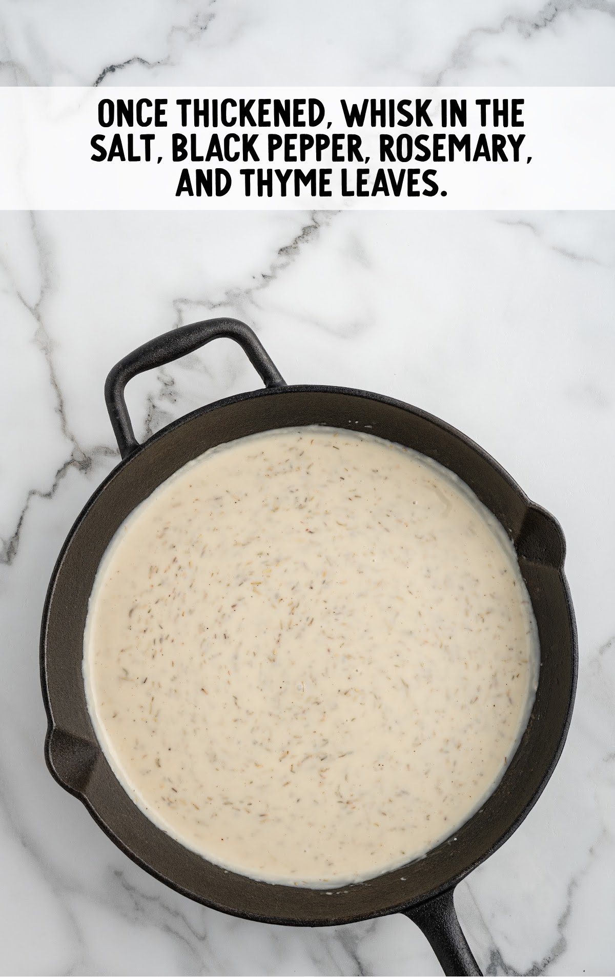 The salt, pepper, rosemany, and thyme are whisked into the skillet.