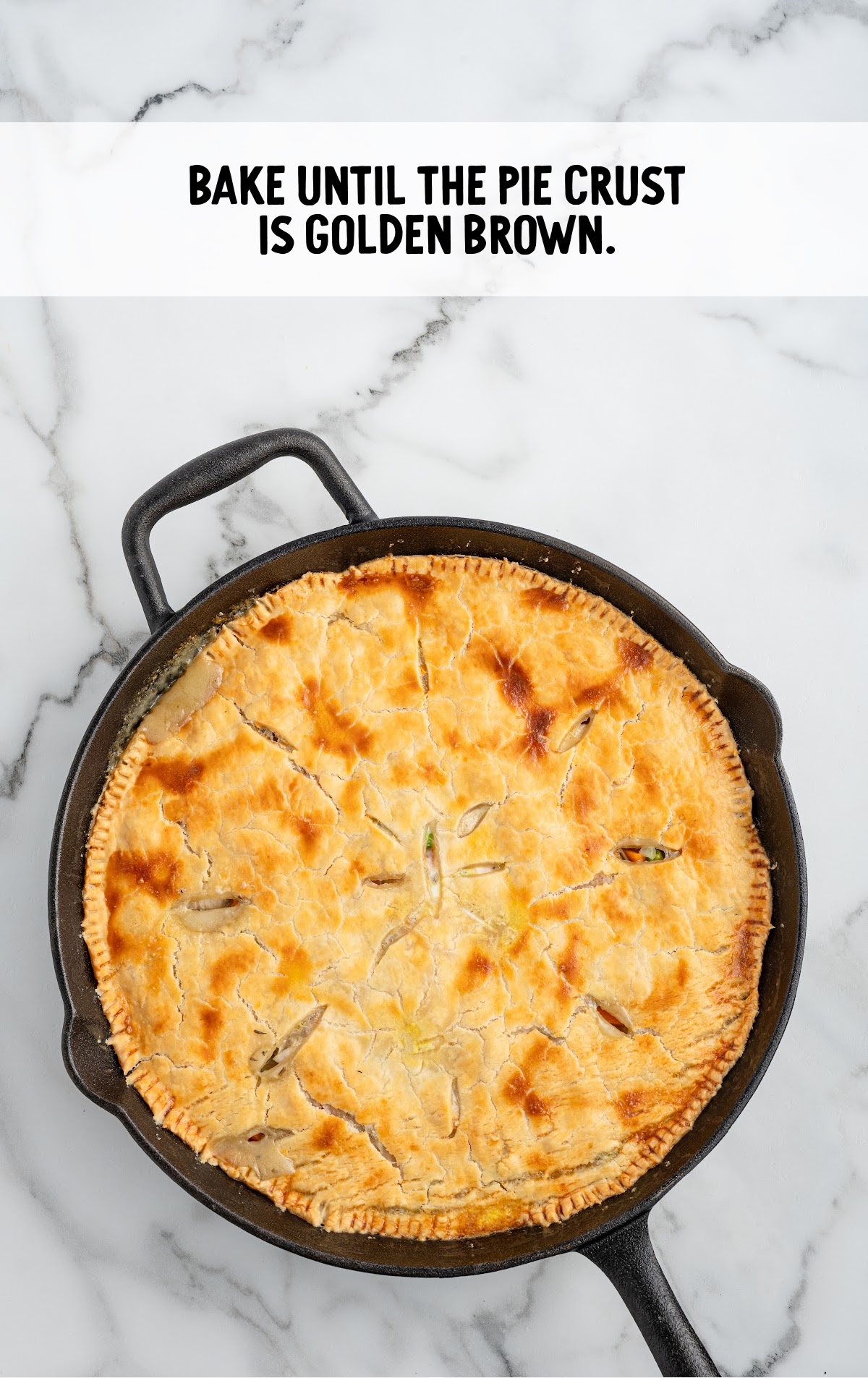 A baked skillet pot pie is golden brown.