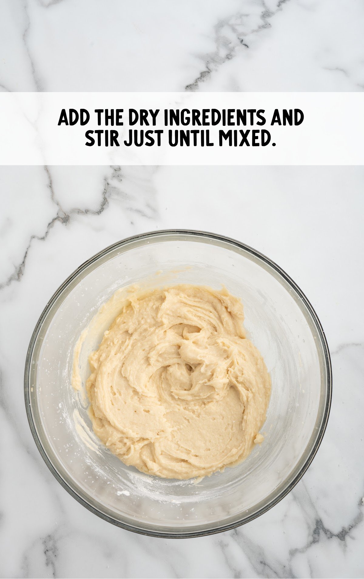 The dry ingredients and wet ingredients are stirred together.