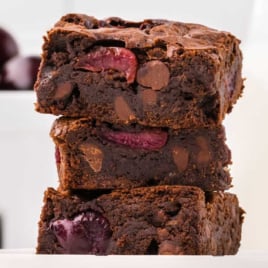 slices of cherry brownies stacked on top of each other