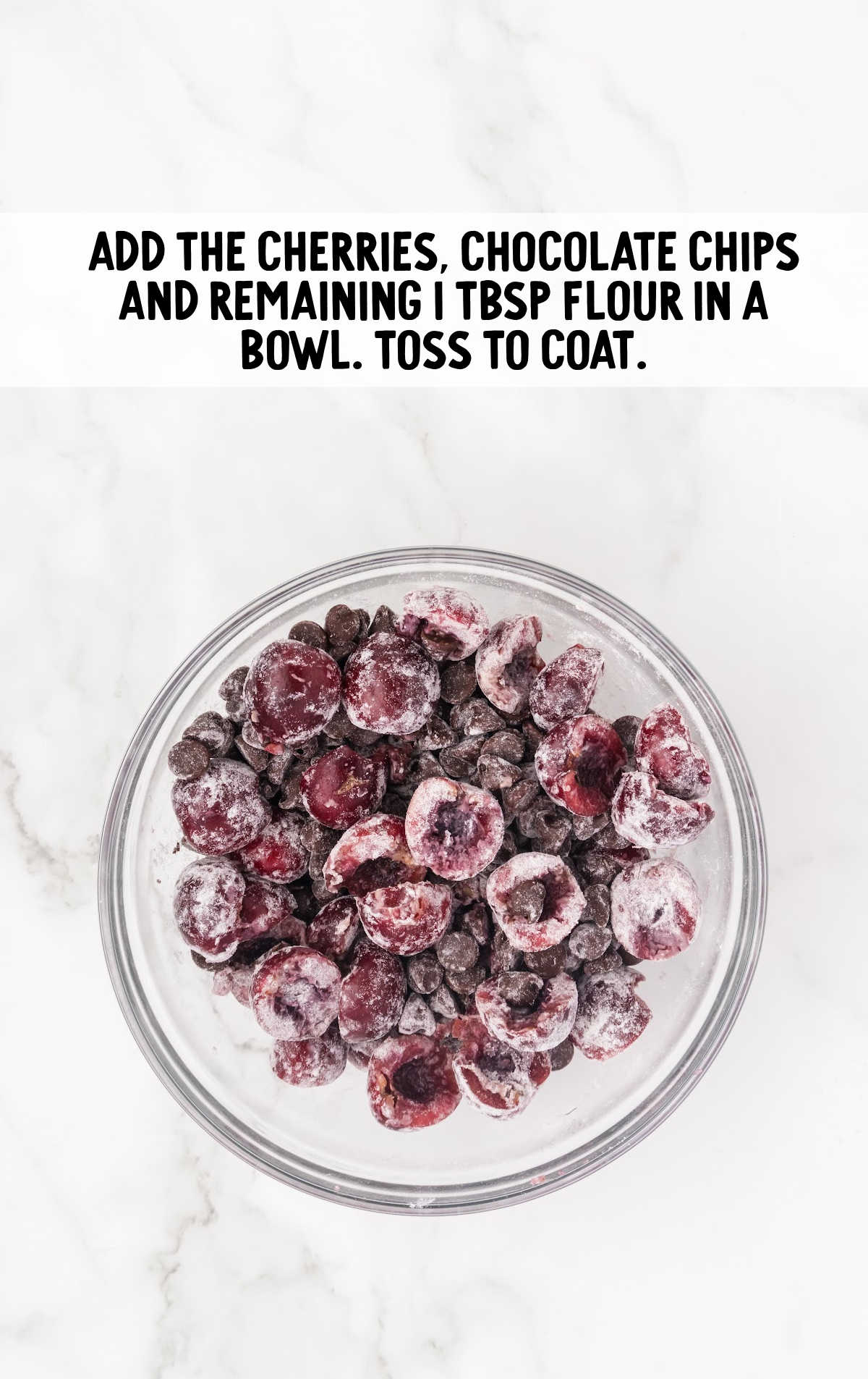 cherries and chocolate chips combined with the flour in a bowl