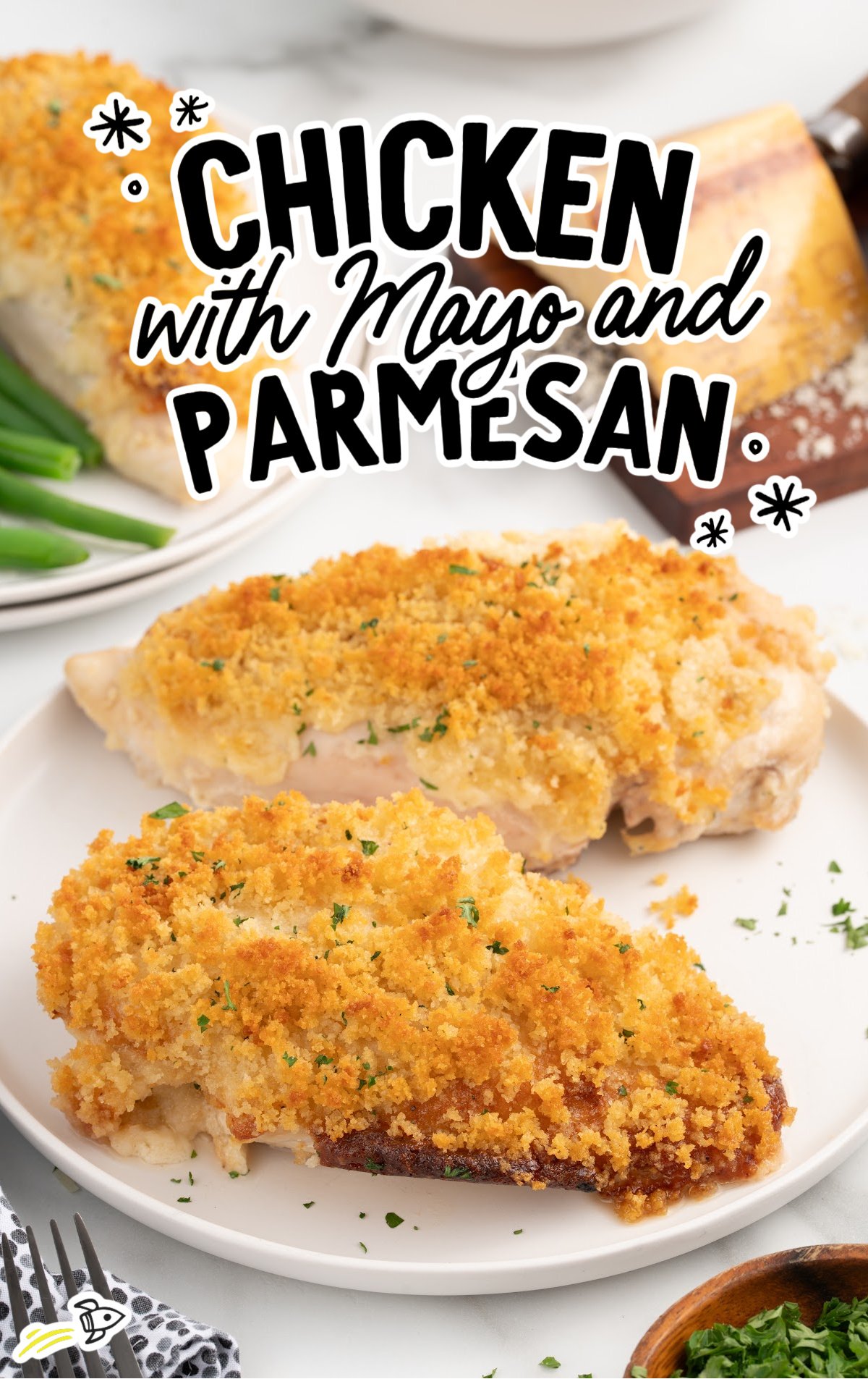 a plate of chicken with mayo and parmesan