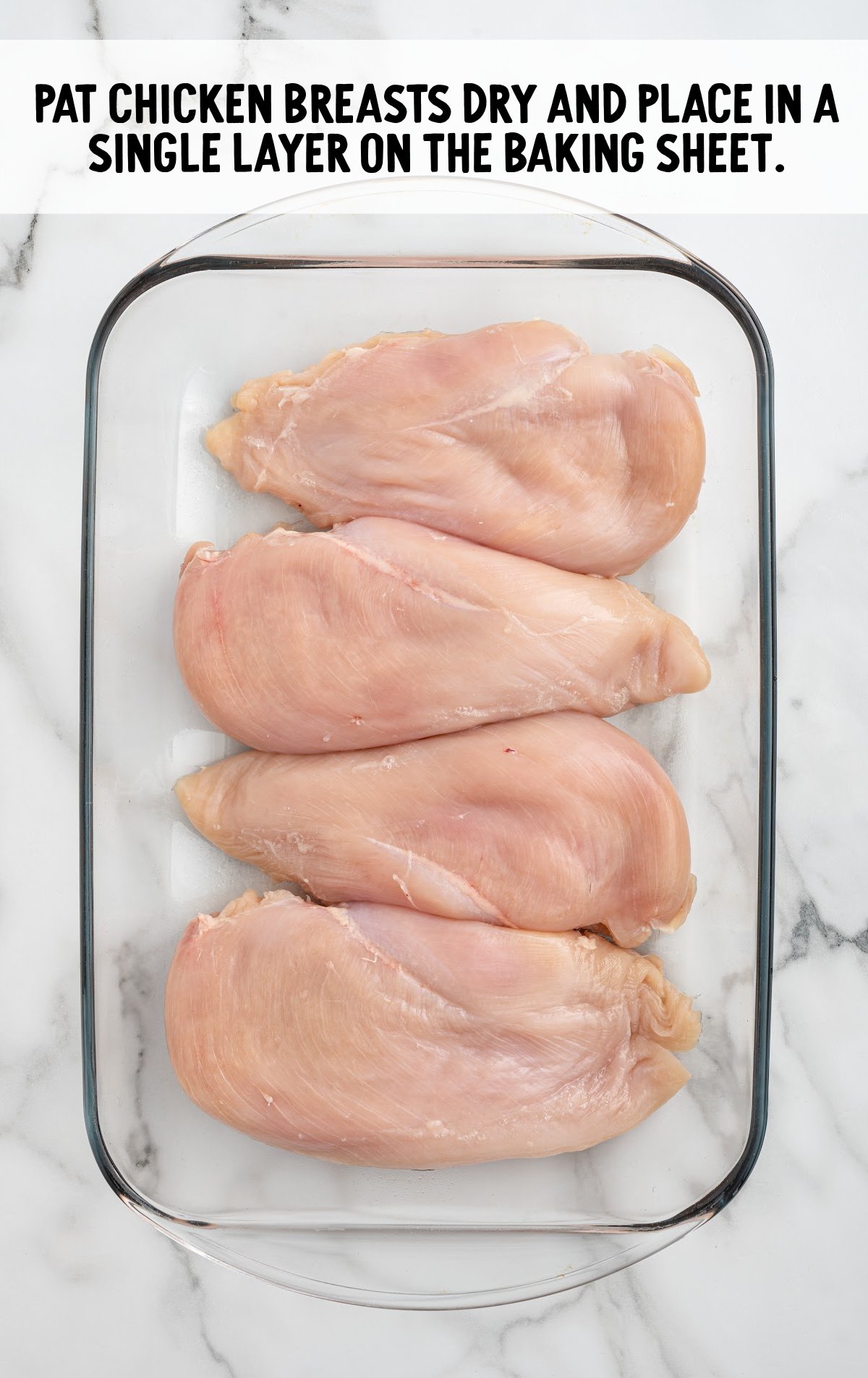 chicken breast placed on a baking sheet