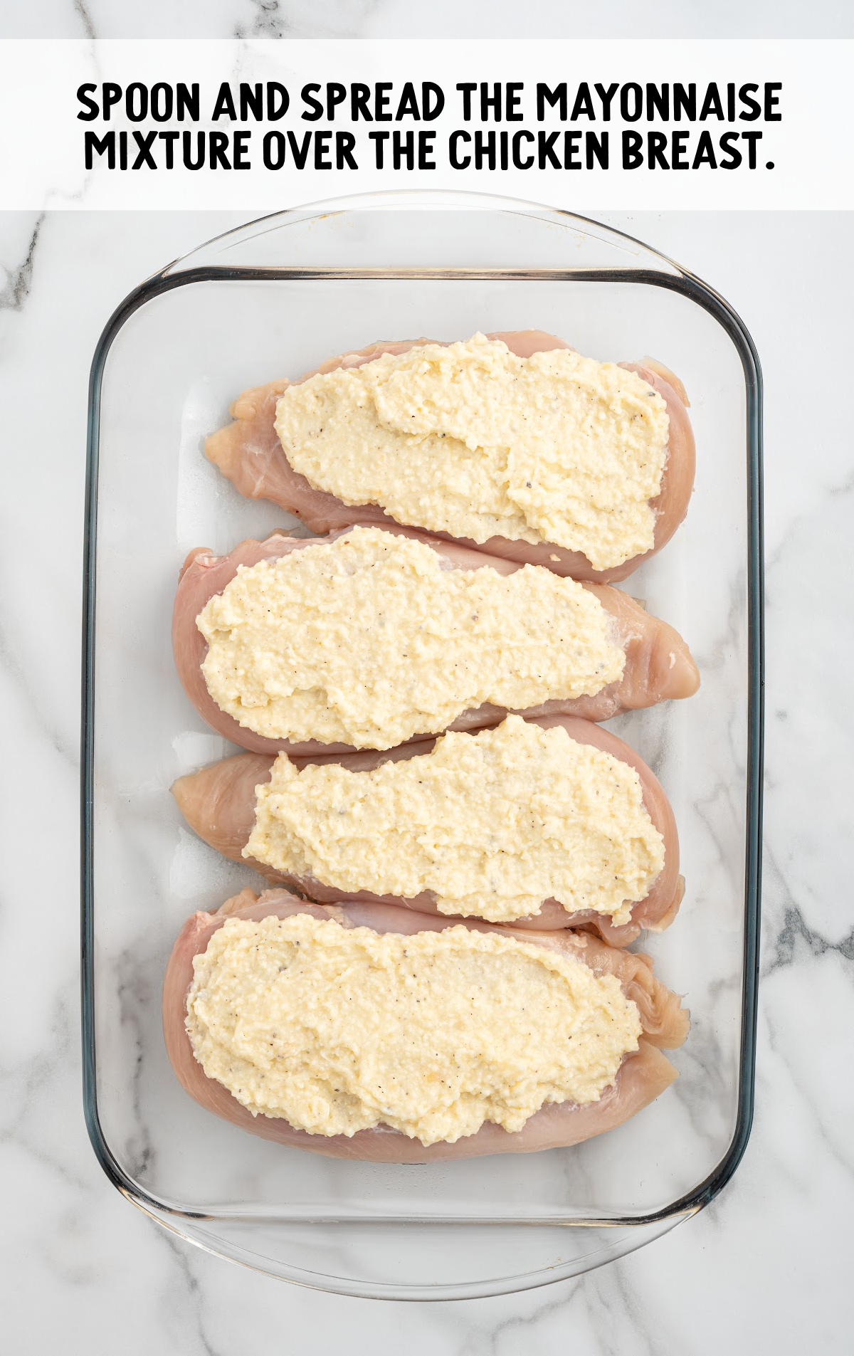 mayonnaise mixture spread over the chicken breast