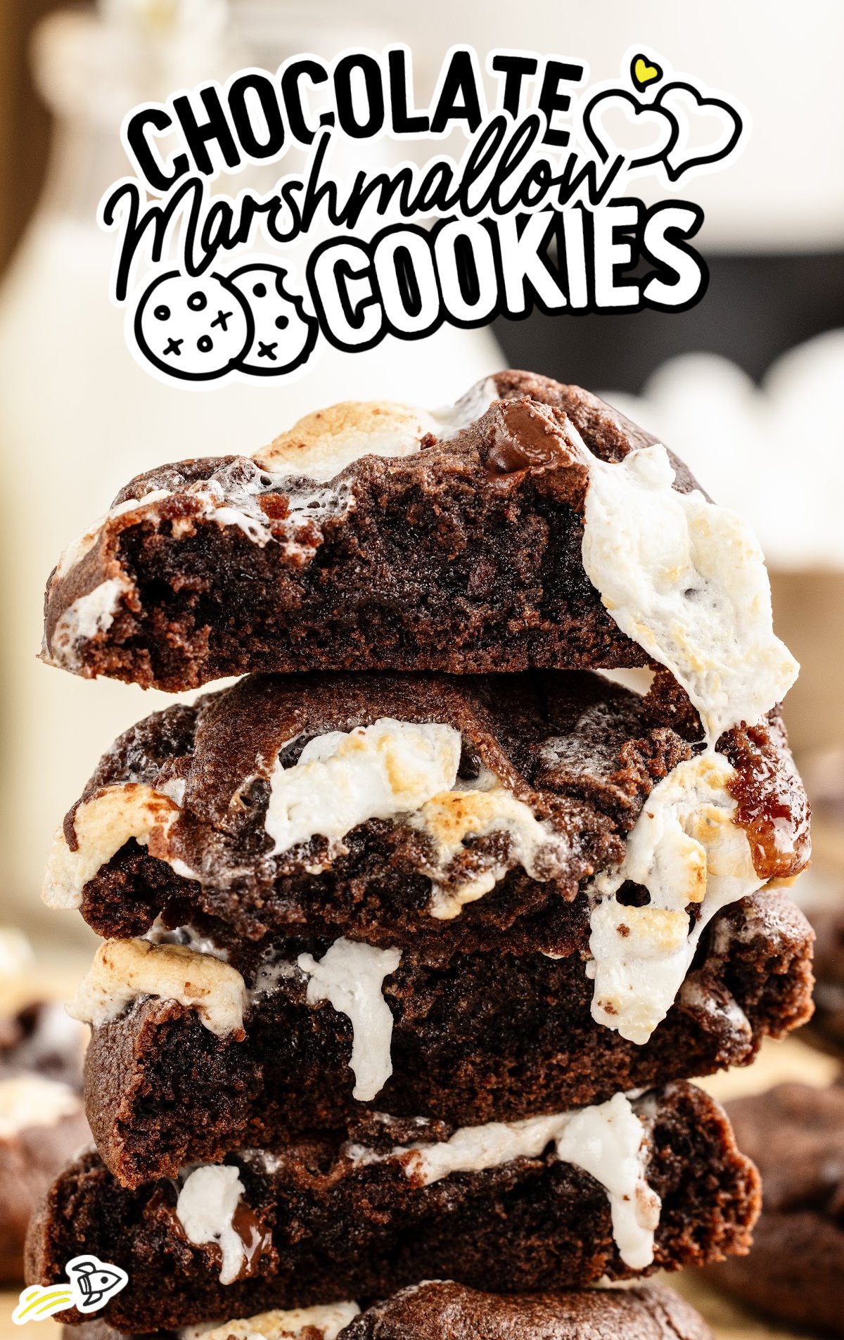 A stack of gooey Chocolate Marshmallow Cookies. They are split open to expose the insides.