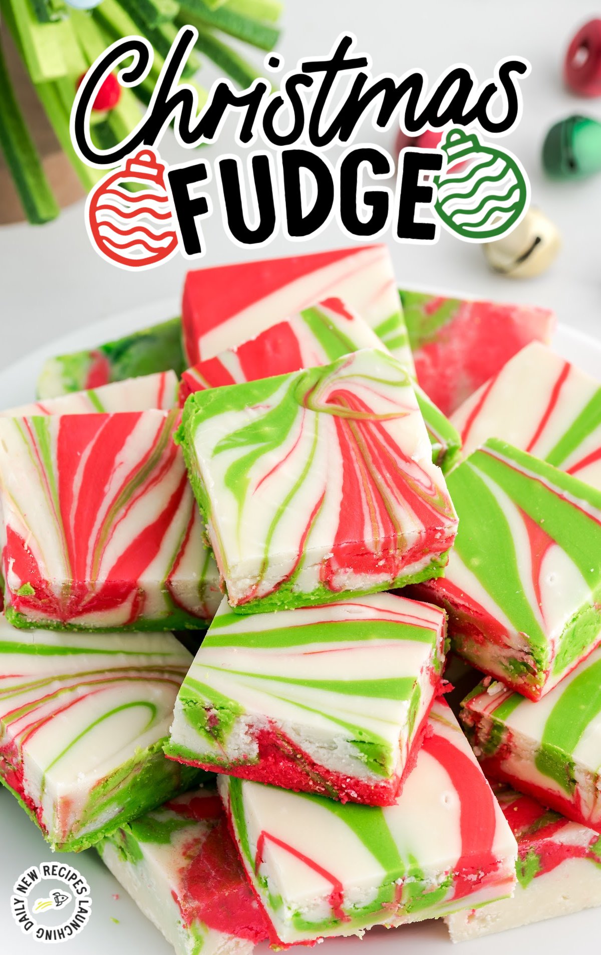 A white plate covered in pieces of Christmas Fudge.