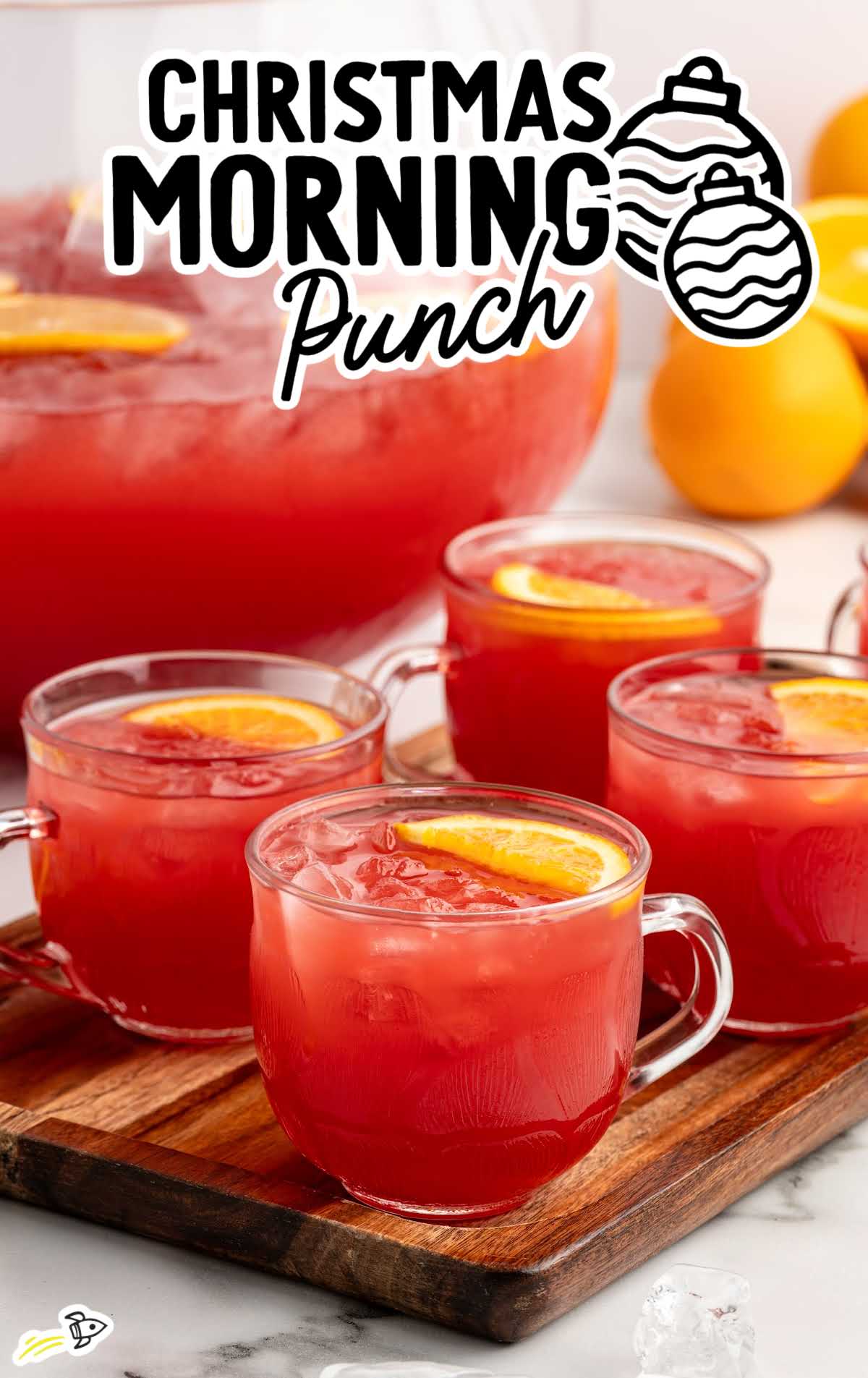 Festive Christmas morning punch in glasses with rosemary, cranberries, and orange slices