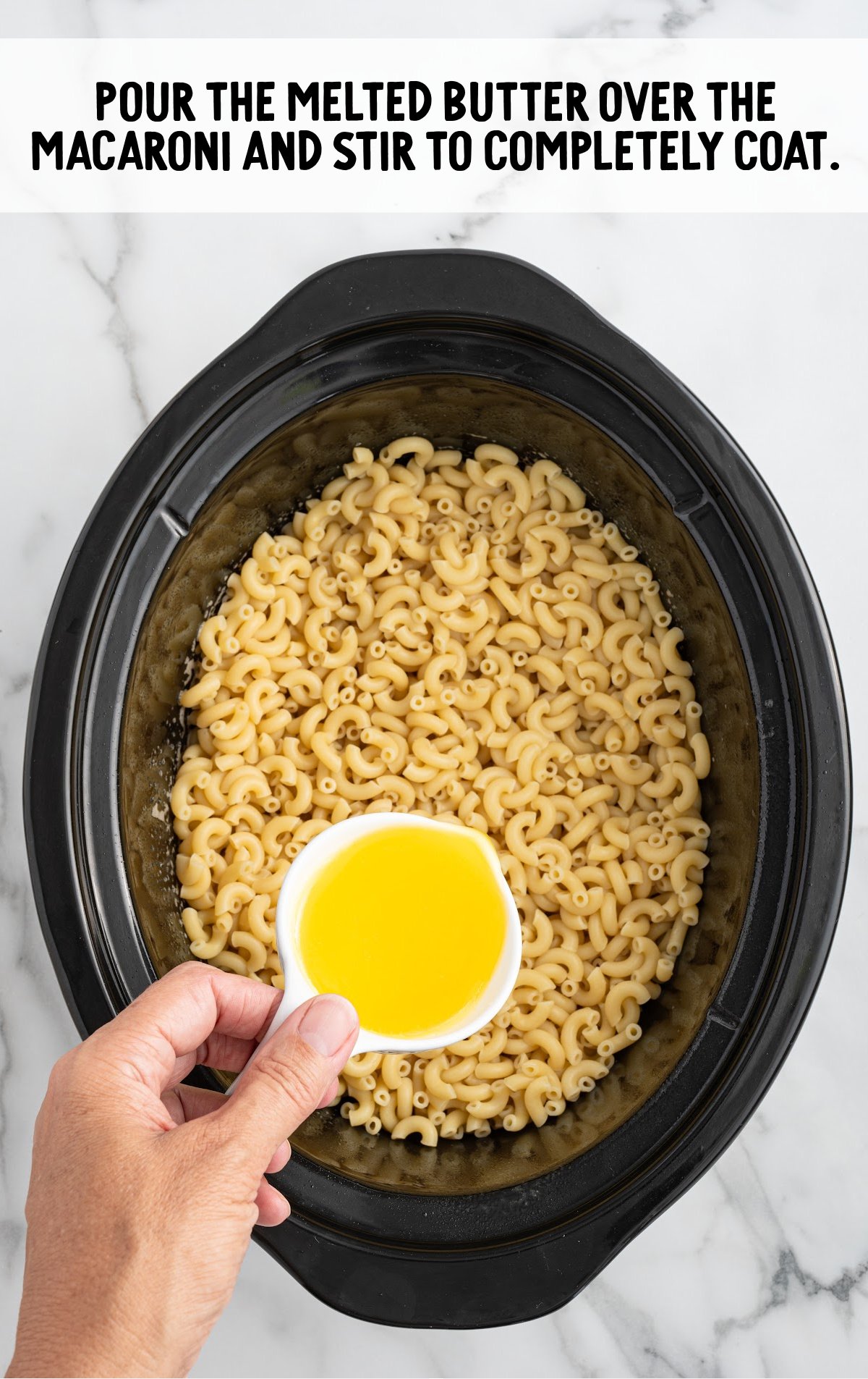 melted butter added to the macaroni pasta in the crockpot