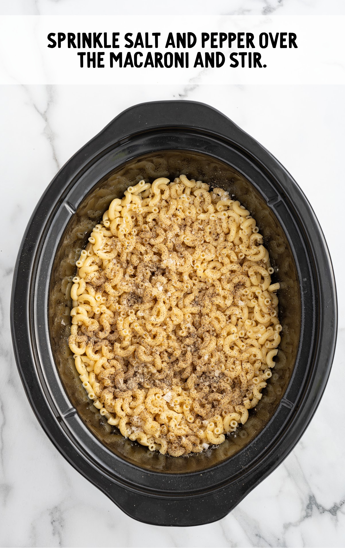 salt and pepper added to the macaroni pasta in the crockpot